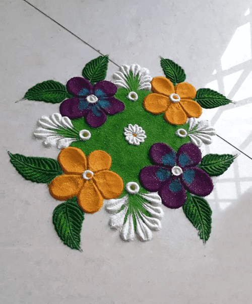 Simple rangoli design of flower on tiles